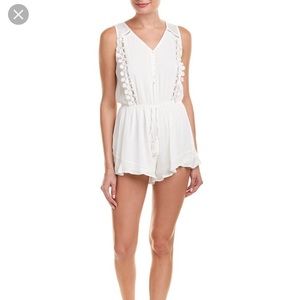 NWOT lost and wander white romper sz small